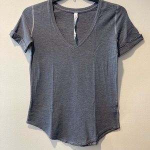 Lululemon Athletica short sleeve gray white stripe athletic exercise gym, size 4